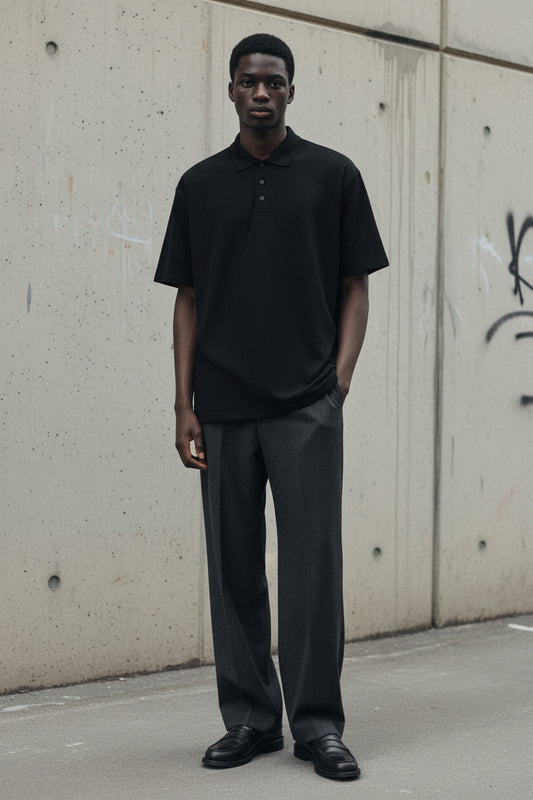 Unisex black Piqué Polo Shirt by Craftklart with a classic collar and button placket, showcasing a sleek, premium design.