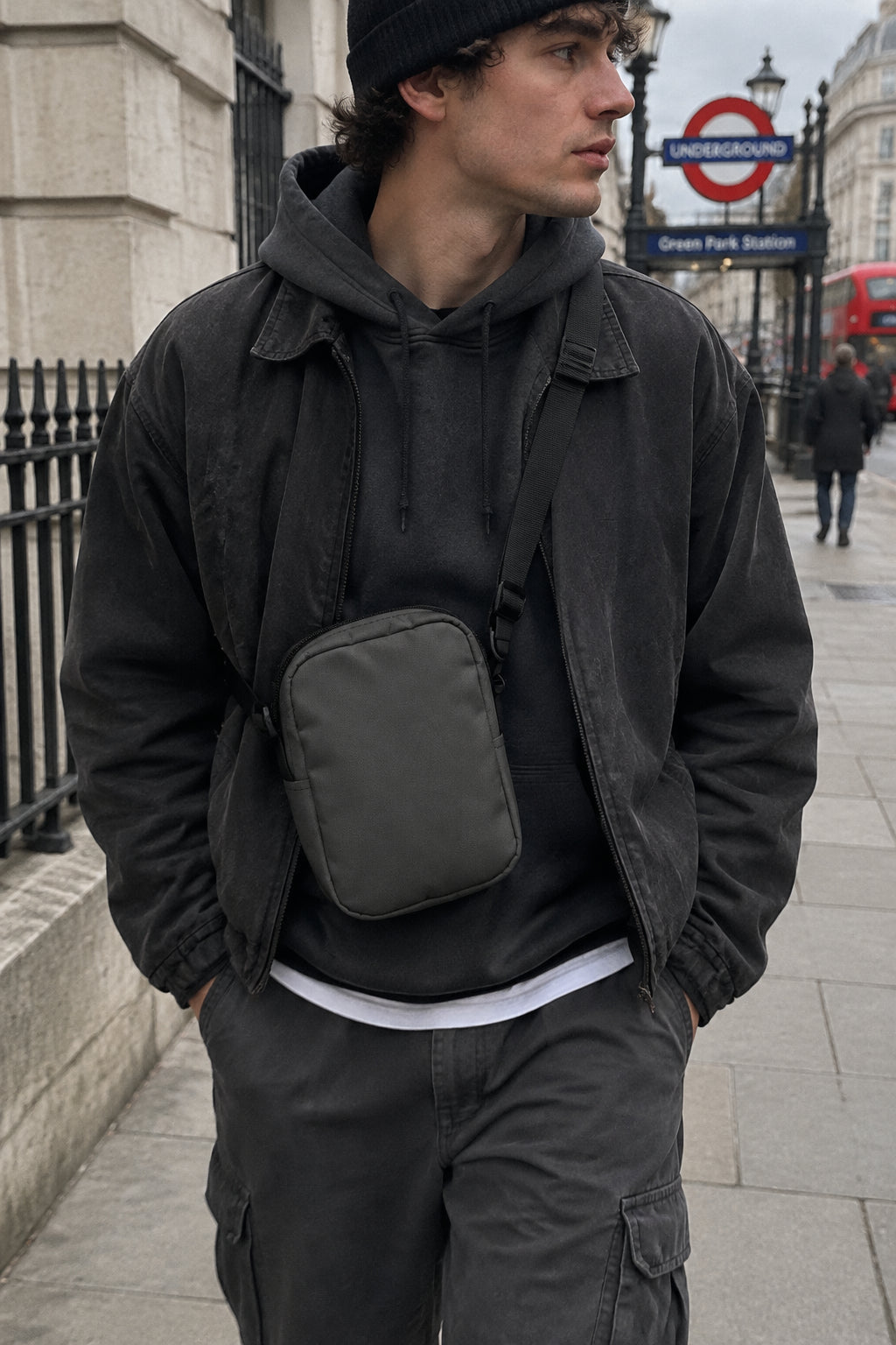 Black Printful K Utility Crossbody Bag, urban streetwear essential with adjustable strap and minimalist design for everyday use.