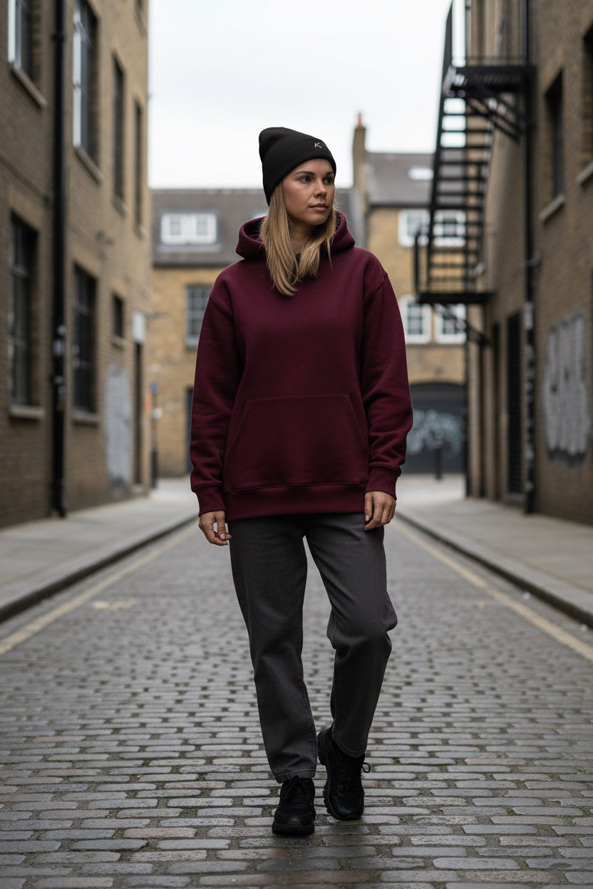 Woman wearing a black Urban Fashion & Streetwear | Craftklart embroidered beanie with a snug, form-fitting design.