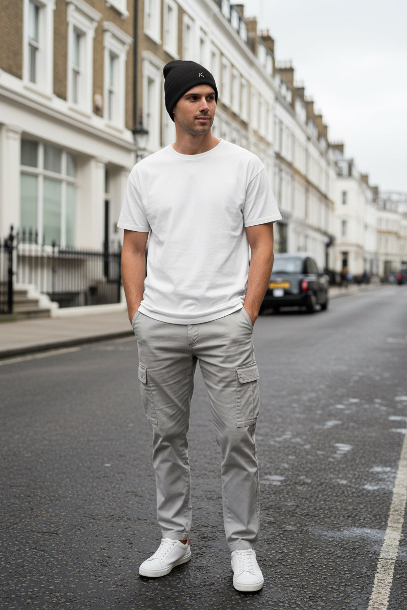 Man wearing a black Urban Fashion & Streetwear | Craftklart embroidered beanie with a snug cotton blend fit.