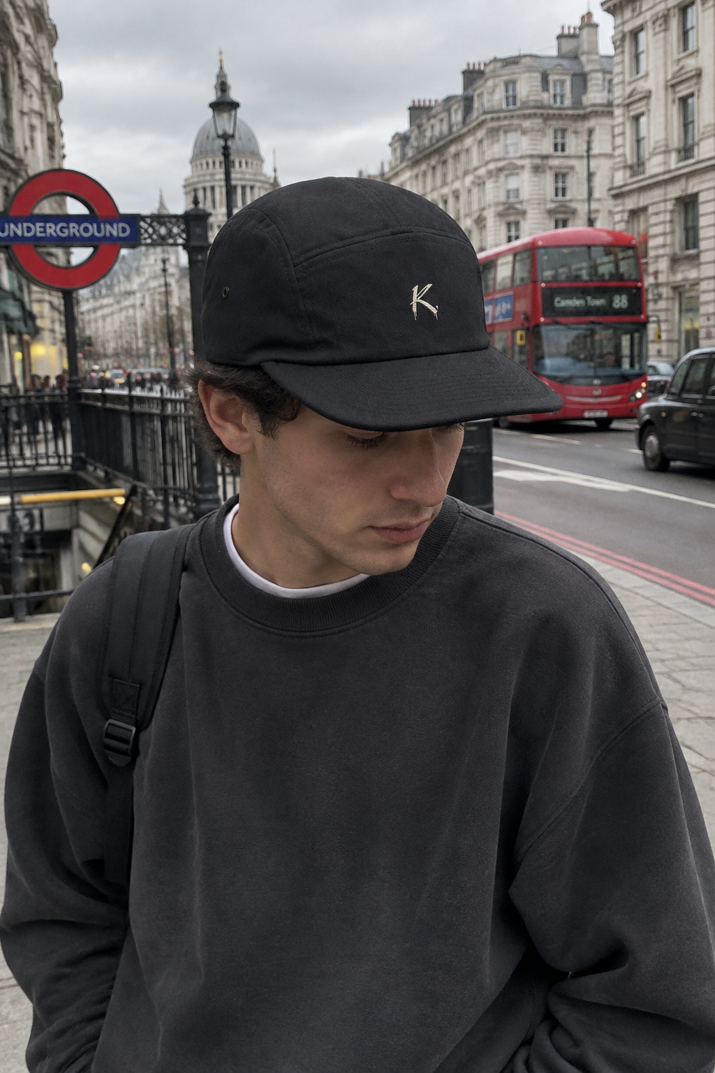 Black C R A F T K L A R T five-panel baseball cap with urban streetwear style, shown from front angle.