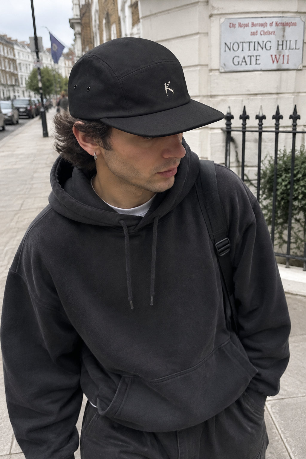 Black Urban K Five Panel Cap by C R A F T K L A R T, stylish streetwear baseball cap with a modern five-panel design.