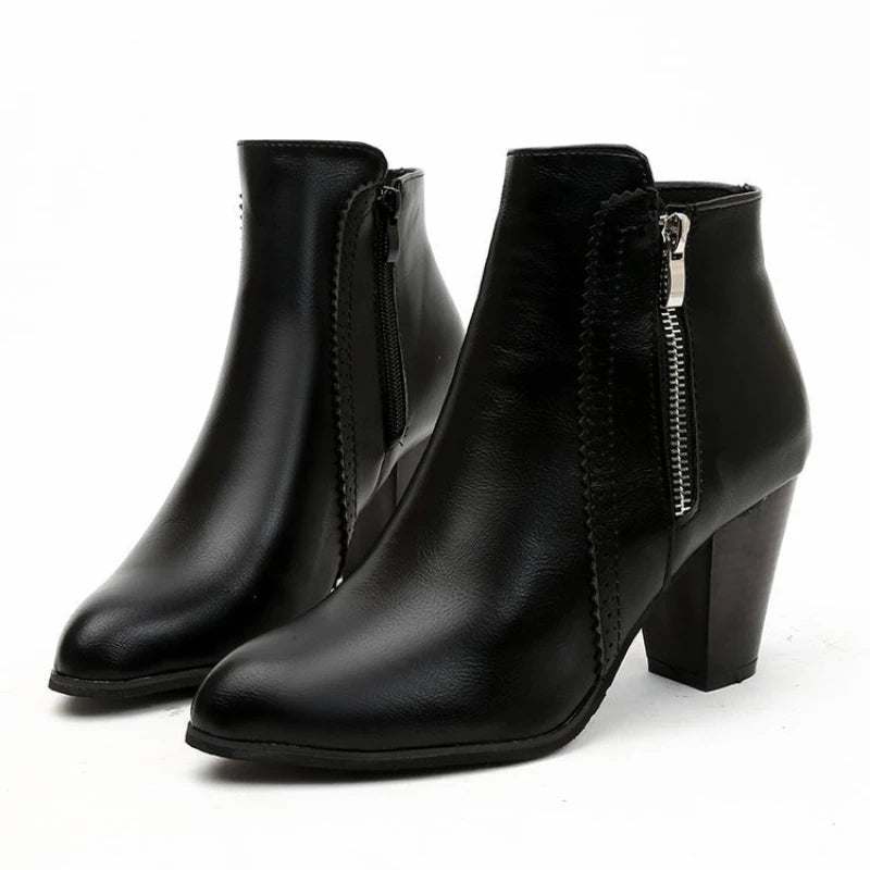 Black Duskline heeled ankle boots for women, stylish urban streetwear footwear with a sleek design and block heel.