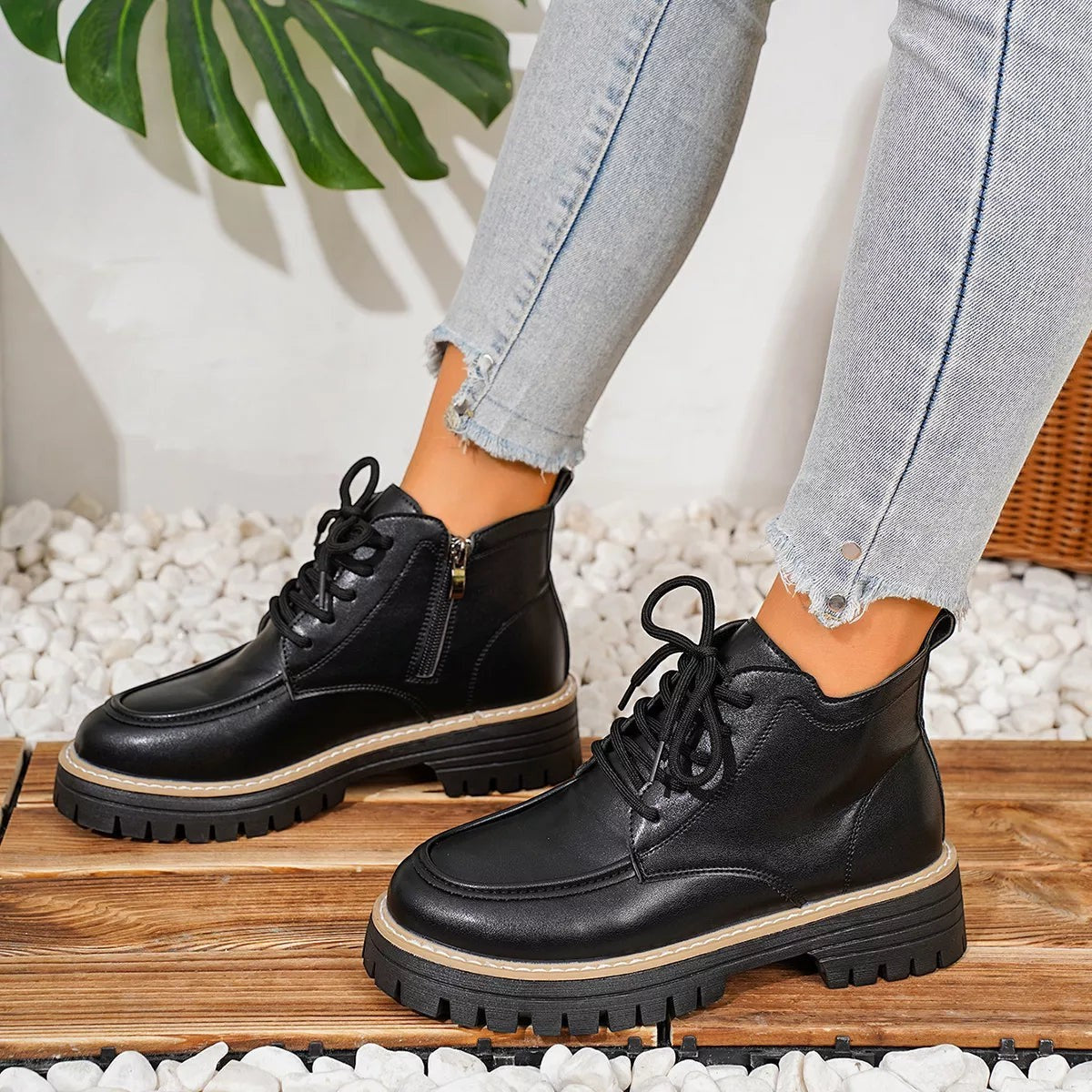 Urban Fashion & Streetwear | Craftklart black lace-up ankle boots with chunky lug soles and side zippers on a model.