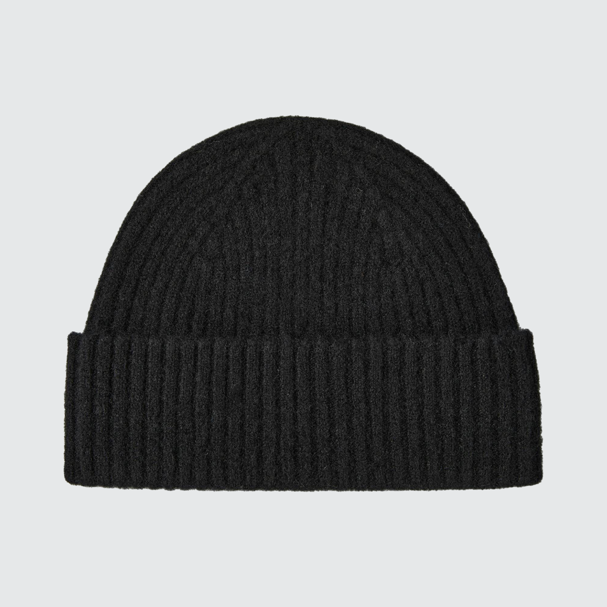 Black ribbed knit winter beanie hat by C R A F T K L A R T, featuring a snug fit and urban streetwear style.