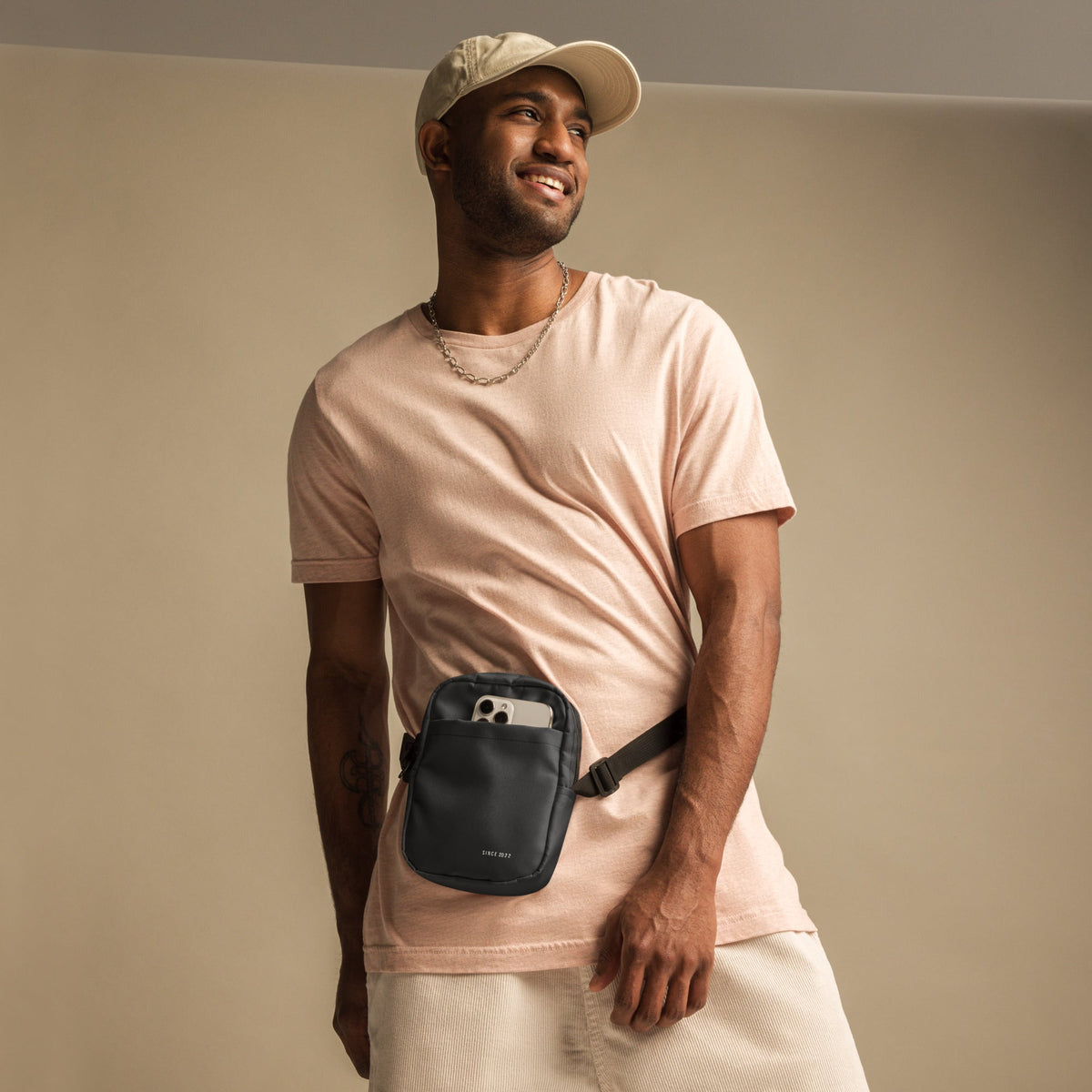 Black K Utility Crossbody Bag by Printful, urban streetwear accessory with adjustable strap and practical design.