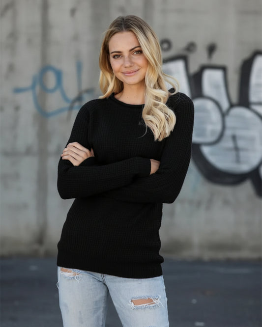 Urban Fashion & Streetwear | Craftklart black waffle knit long sleeve crewneck sweater worn by a blonde woman