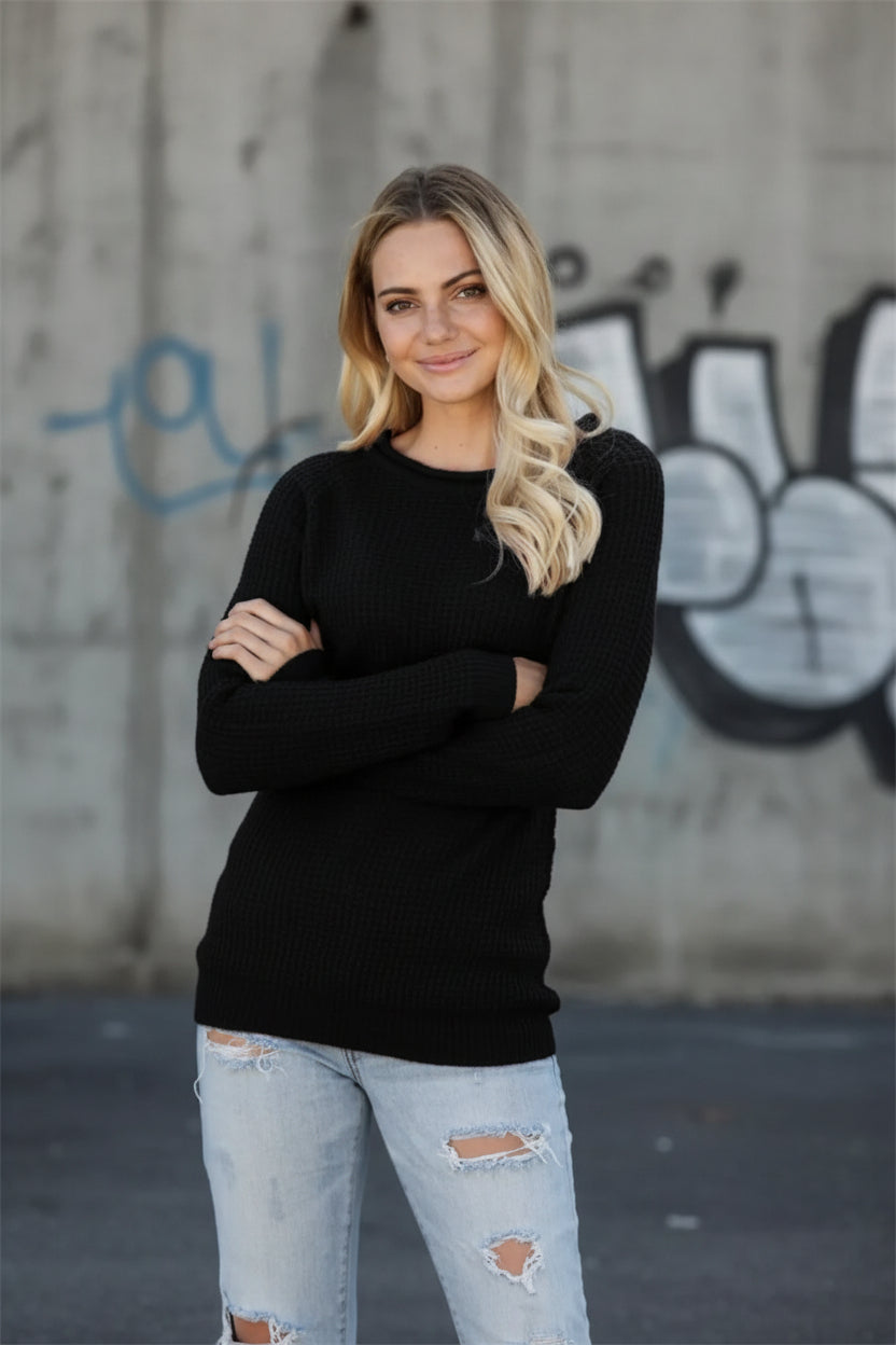 Urban Fashion & Streetwear | Craftklart black waffle knit long sleeve crewneck sweater worn by a blonde woman