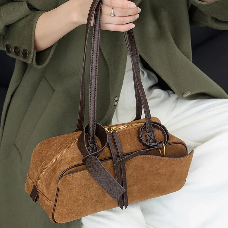 Craftklart brown leather tote bag with structured design, spacious interior, suede accents, perfect for urban fashion and commuting.