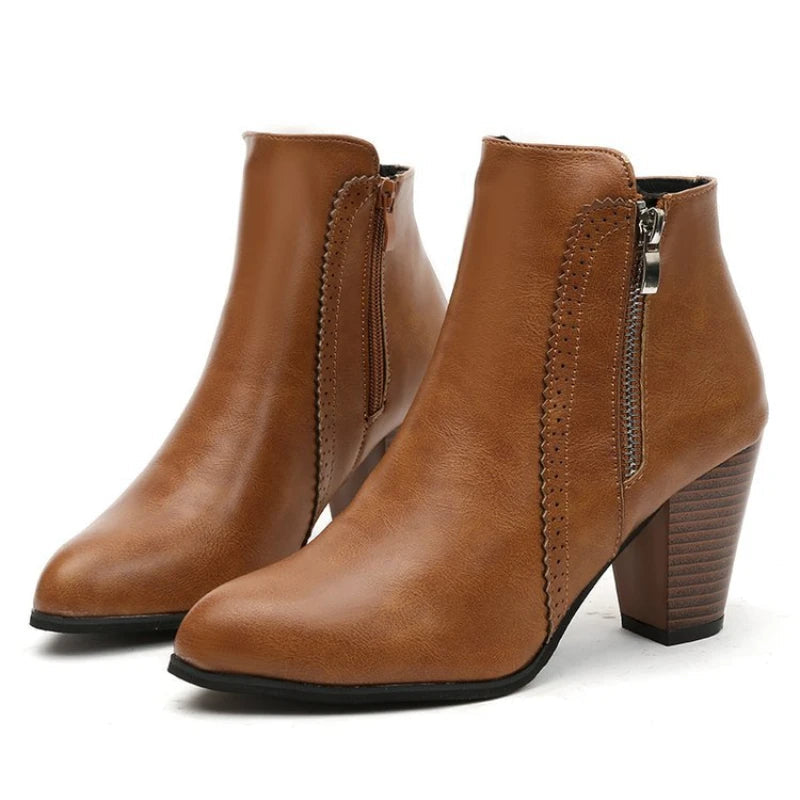 Brown crafted women's ankle boots with a heeled design, perfect for urban streetwear fashion.