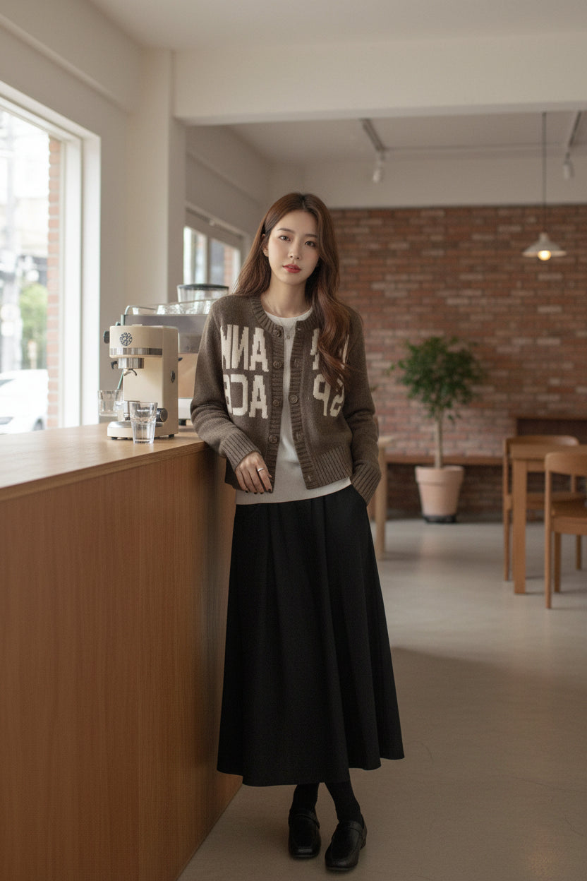 Urban Fashion & Streetwear | Craftklart camel letter jacquard knit cardigan worn over a white top and black skirt