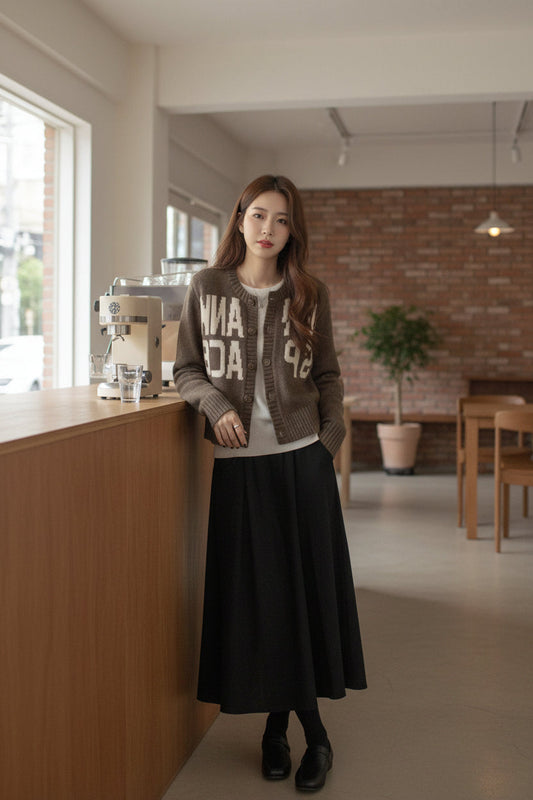 Urban Fashion & Streetwear | Craftklart camel letter jacquard knit cardigan worn over a white top and black skirt