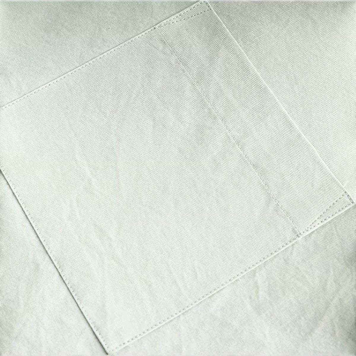 Close-up of the light grey cotton fabric and clean stitching detail on an Urban Fashion & Streetwear | Craftklart shirt