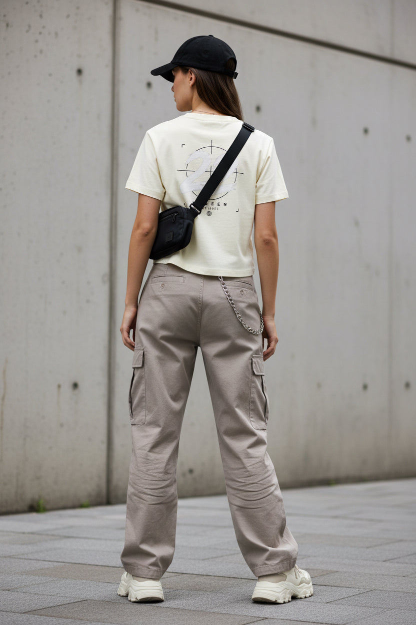 Back view of Urban Fashion & Streetwear | Craftklart cream cropped cotton t-shirt with a white 22 graphic print.