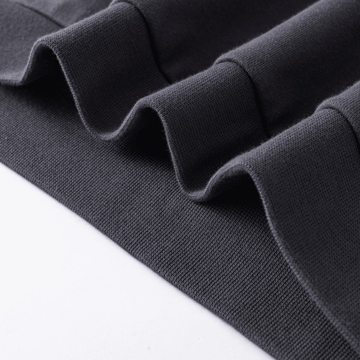 Close-up of heavy 445GSM dark grey fabric texture from Urban Fashion & Streetwear | Craftklart sweatshirt