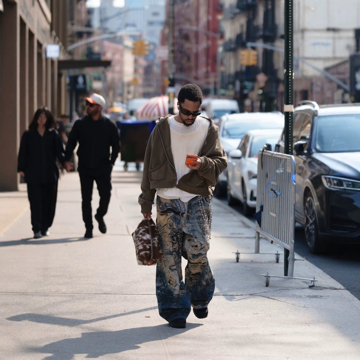 Urban Fashion & Streetwear | Craftklart distressed denim jeans with 3D graffiti print worn by a man on a city street
