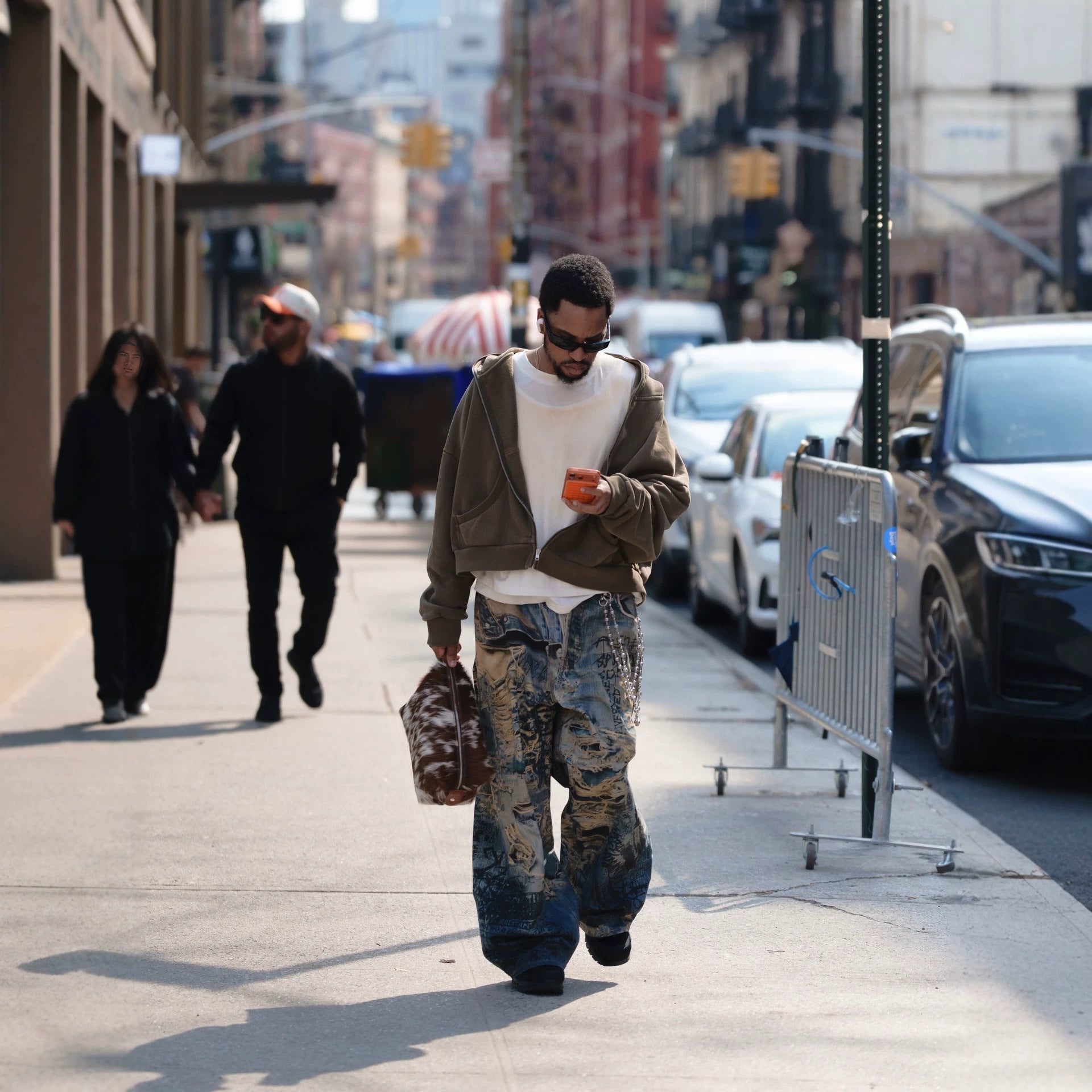 Urban Fashion & Streetwear | Craftklart distressed denim jeans with 3D graffiti print worn by a man on a city street