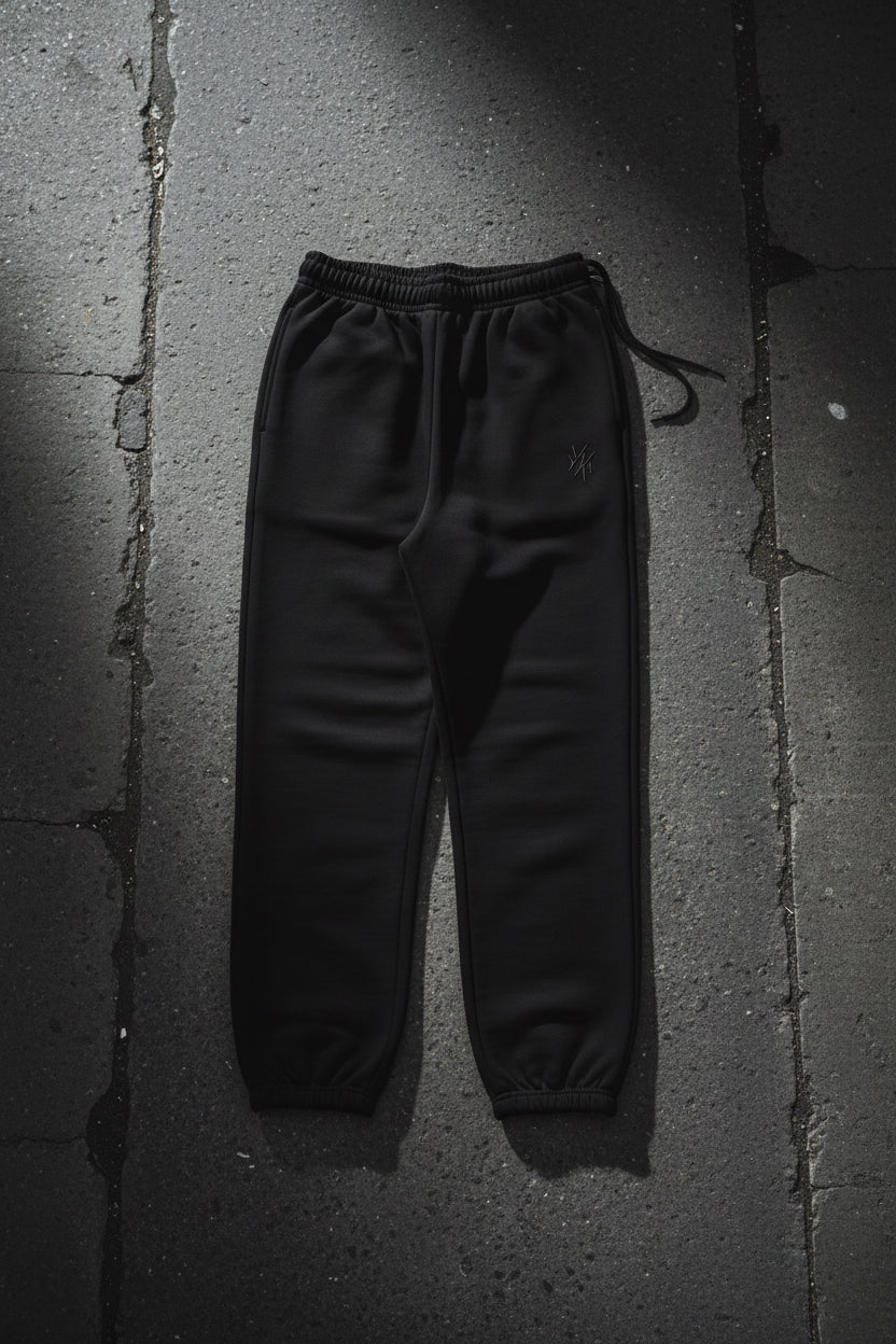 Black heavyweight CKL Urban Authority sweatpants with relaxed fit fleece fabric, featuring an urban streetwear style and logo details.