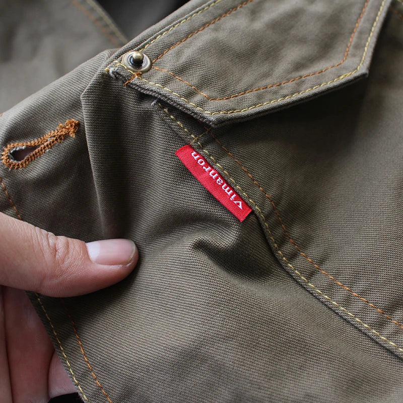 Urban Fashion & Streetwear | Craftklart olive green cotton utility vest with contrast stitching and red brand label