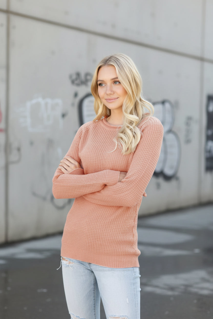 Urban Fashion & Streetwear | Craftklart peach waffle knit long sleeve crewneck sweater worn by a blonde model.