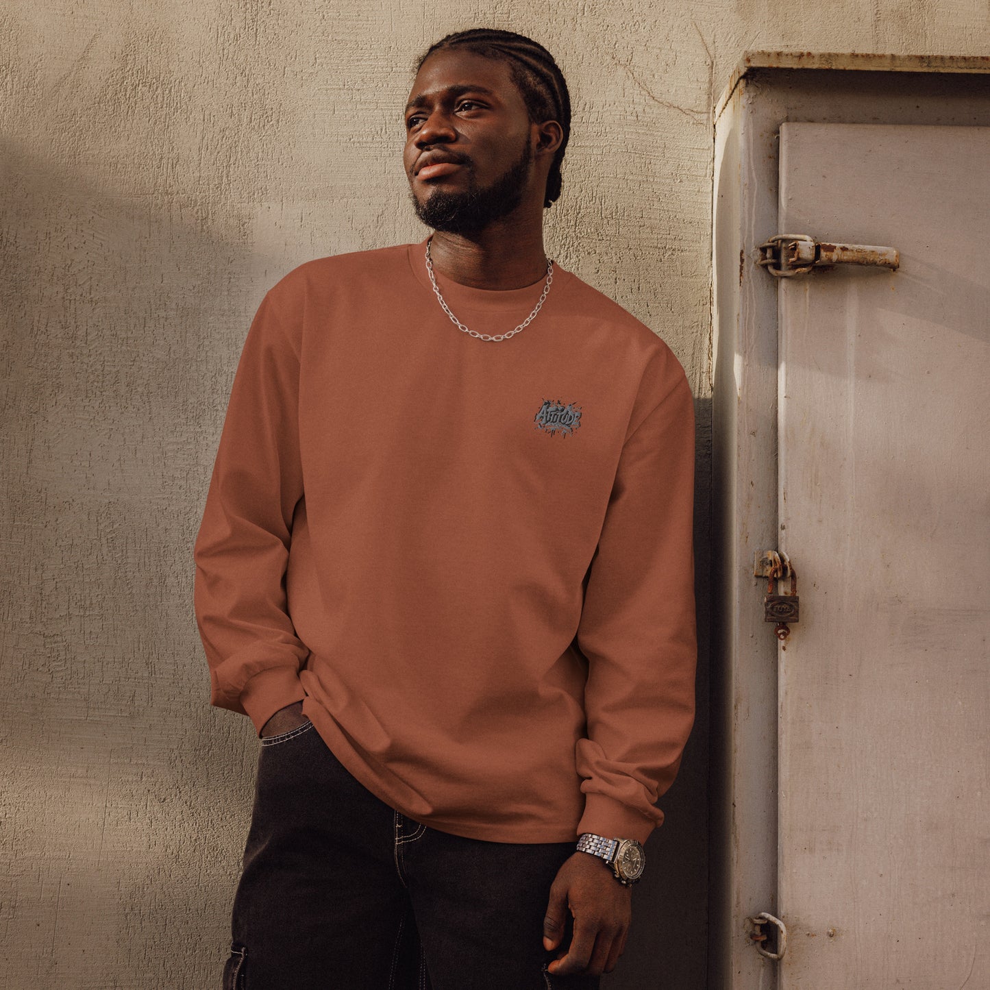 Urban Fashion & Streetwear Attitude Premium heavyweight long sleeve printed sweater in clay color with bold graphic design.