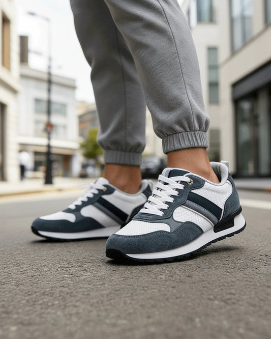 Urban Fashion & Streetwear | Craftklart retro mesh and suede sneakers in dark blue and white worn on city street