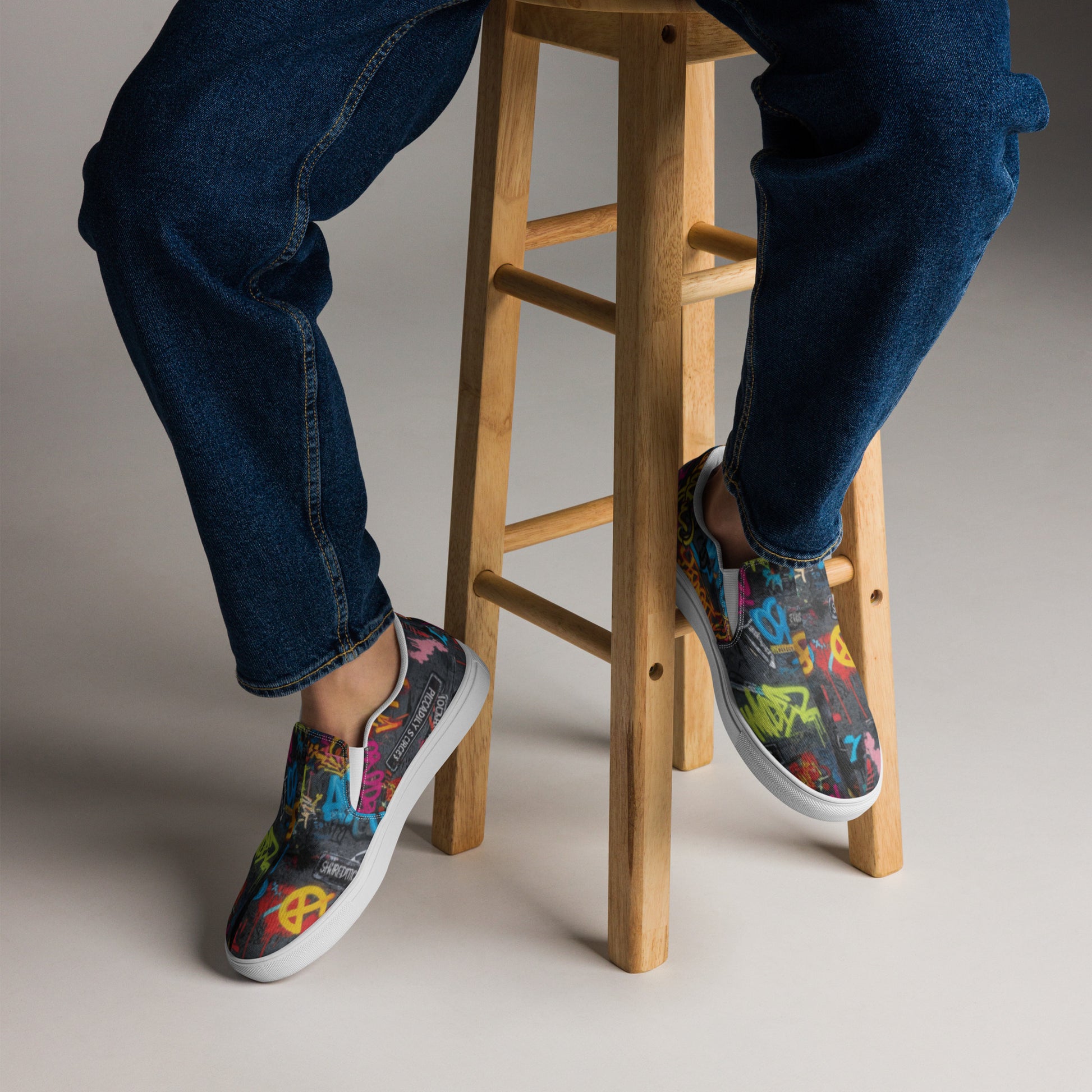 Men’s graffiti slip-on canvas shoes by Urban Fashion & Streetwear Craftklart featuring vibrant street art designs on casual shoes.