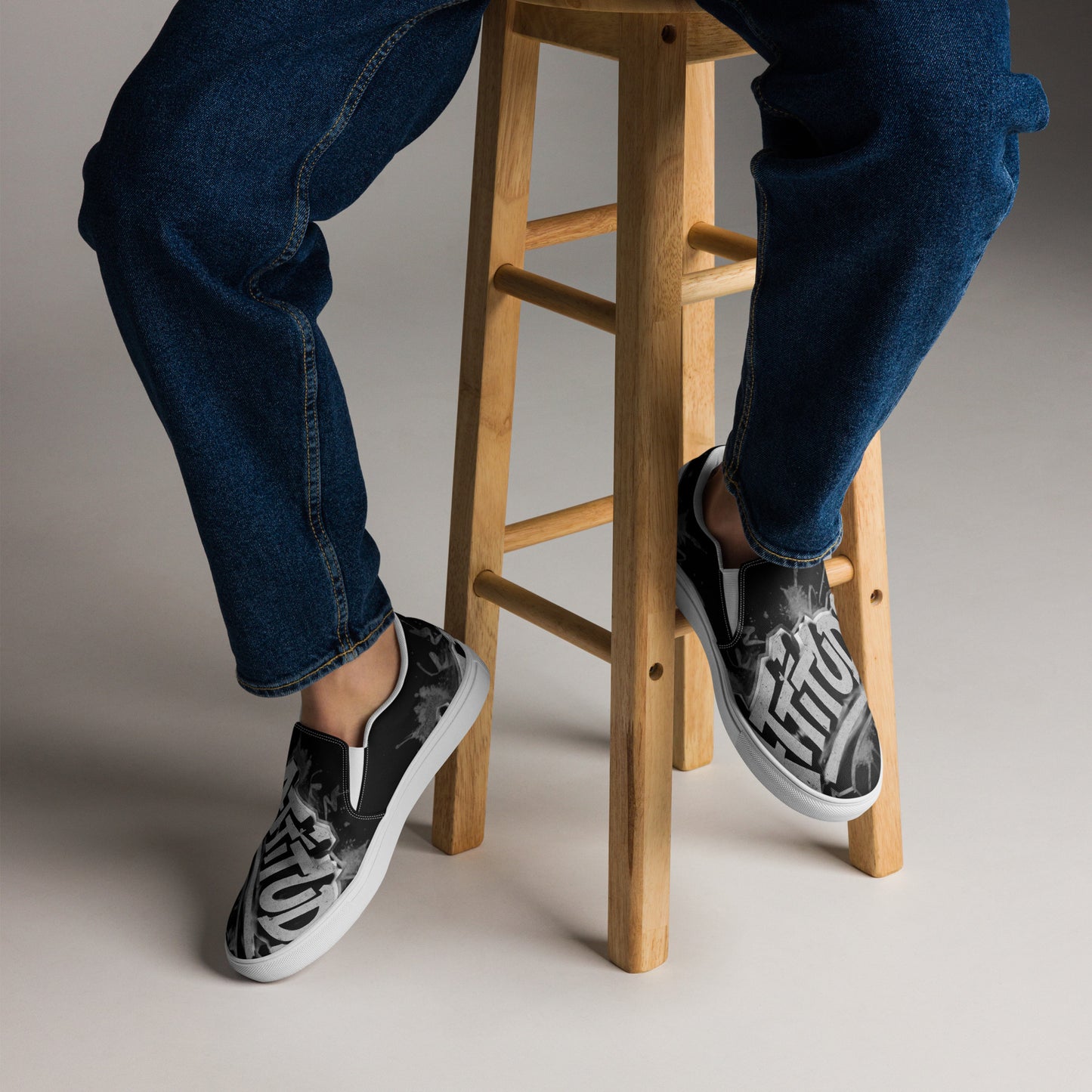 Black Attitude Urban Men’s slip-on canvas shoes with white soles, casual streetwear style, featuring a sleek, modern design.