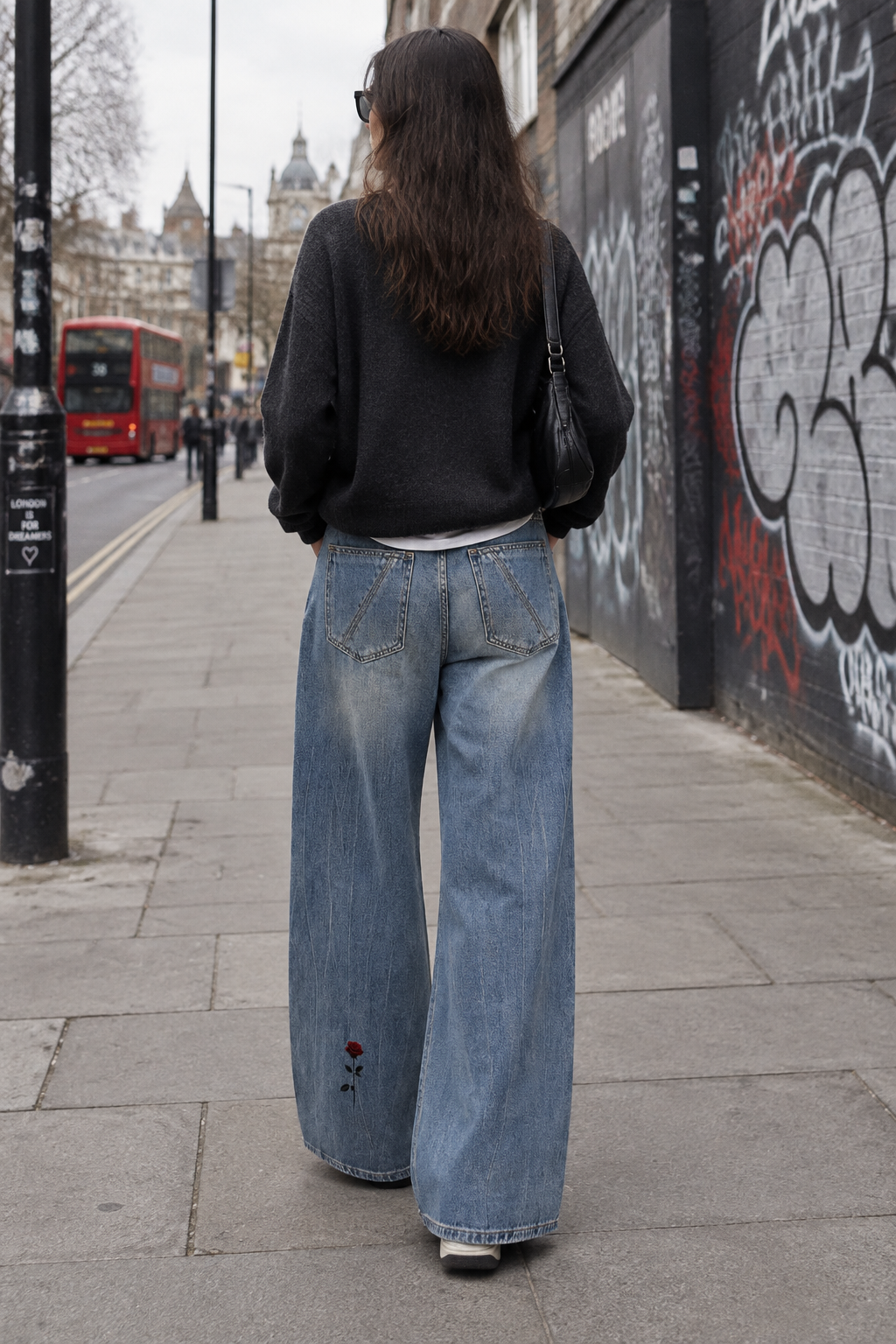 ODMPOD Daybreak Wide Leg Jeans showing urban streetwear style, high-waisted fit, and wide-leg silhouette on a casual model.